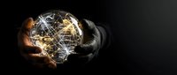 Hands holding glowing digital globe network with interconnected light lines on dark background, representing global communication, technology, and worldwide connectivity.