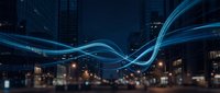 Digital light trails flowing through modern city skyline at night creating dynamic energy waves for technology and urban connectivity concepts.