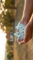 Adult male hand holding glowing neon circuit board hologram overlay against blurred outdoor background, representing digital technology, innovation, and future connectivity solutions.