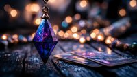 Mystical blue crystal pendant and tarot cards on dark wooden surface with magical bokeh lights creating spiritual divination atmosphere.