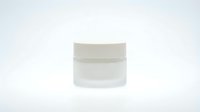 White cosmetic jar container with lid isolated on clean background for skincare product packaging and beauty brand design.