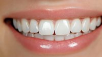 Close up of healthy white teeth and pink lips showing natural smile, dental care concept for oral hygiene and cosmetic dentistry advertising.
