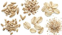 Assorted organic cereal grains and seeds collection isolated on white background for healthy nutrition and cooking ingredients design projects.