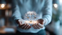 Glowing scales of justice floating above cupped hands with magical sparkles and light effects, symbolizing legal wisdom and fairness in modern law practice.