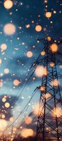 Electrical power transmission tower silhouette against blue evening sky with glowing golden bokeh lights and power lines creating magical atmosphere.
