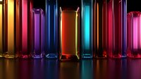 Colorful glass columns with vibrant neon lighting effects create dramatic reflections on dark surface. Glowing transparent prisms in red, blue, purple and orange.