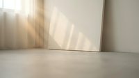 Minimalist interior corner with warm sunlight streaming through window creating soft shadows on white wall and light wooden floor for modern home design.