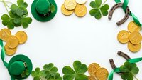 Flat lay frame with green leprechaun hats, golden coins, horseshoes and shamrock leaves on white background. Perfect for St. Patrick's Day celebrations, holiday promotions and festive designs.