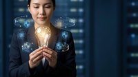 Asian businesswoman holding glowing lightbulb with digital security shield icons representing cybersecurity innovation and data protection technology.