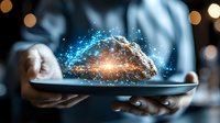 Digital cloud technology glowing above tablet device in businessman hands with sparkle light effect and bokeh background for cloud computing concept.