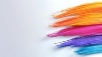 Vibrant brush strokes in rainbow colors fade into white background, creating dynamic motion effect. Modern abstract art composition shows flowing paint marks in bright hues.