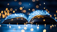 Magical open book with glowing blue light and golden bokeh effect on dark background, creating mystical atmosphere for fantasy and storytelling concepts.