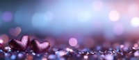 Romantic pink metallic hearts on glitter surface with dreamy bokeh background in purple and blue tones, macro photography for Valentine's Day designs.