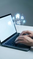 Digital real estate technology concept with hands typing on laptop and floating property icons for online housing market applications.