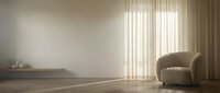 Minimalist interior with curved armchair, wooden floor, and sheer curtains filtering natural light through large windows, creating serene ambiance for home decor and design projects.