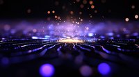 Glowing purple and gold particles radiating from central light burst with bokeh effect on dark background, creating magical atmospheric depth for design projects.