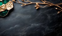 Luxurious dark marble background with golden branch and emerald green leaf decoration in corner, creating elegant composition for luxury product display.