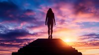 Female silhouette standing on top of steps against dramatic purple and orange sunset sky. Concept of success, achievement, spirituality and personal growth.