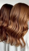 Luxurious wavy brown hair with caramel balayage highlights showcasing professional hair coloring technique and healthy shine on light background.