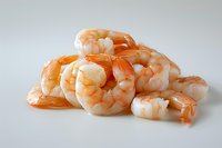 Fresh cooked shrimp tails on white background, perfect for seafood menu, restaurant advertising and culinary projects. Clean professional food photography.