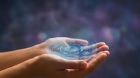 Hands holding glowing digital globe with holographic earth, representing global connectivity, technology innovation, and worldwide business communication networks.