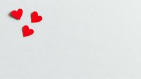Three red hearts on white background for Valentine's Day romance love greeting cards wedding invitations romantic designs isolated clipart.