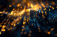 Abstract digital wave of glowing particles with orange and blue light effects on dark background, creating futuristic technology visualization pattern.