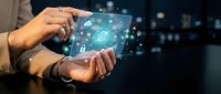 Businessman holding tablet with digital security icons and network connections glowing in air, representing cybersecurity and data protection technology solutions.