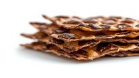 Crispy bacon strips stacked in layers showing golden brown texture and appetizing meat preparation for breakfast cooking and culinary food photography.