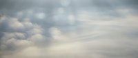 Dramatic overcast sky with layered gray and white clouds creating moody atmospheric conditions for weather backgrounds and nature photography.
