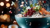 Fresh organic acai bowl topped with red currants, chia seeds and granola in turquoise ceramic bowl against dark background with bokeh lights and falling ingredients.