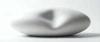 Smooth gray zen stone with natural indentation creating calming meditation focal point for wellness and mindfulness practices on clean white background.
