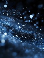 Glowing blue bokeh lights and sparkles on dark background create magical atmosphere with blurred particles and shimmering effect for festive designs.