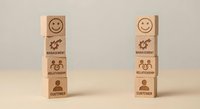 Wooden blocks with business icons stacked showing management hierarchy and organizational structure for corporate training presentations.