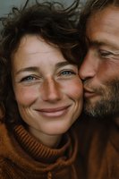Happy mature couple embracing outdoors showing genuine love and connection in warm autumn sweaters with natural lighting and authentic smiles.