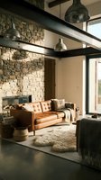 Modern loft living room with cognac leather sofa, exposed stone wall, black steel beams, pendant lights, and large windows for interior design and home decor projects.
