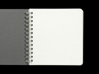 Spiral bound notebook with gray cover and blank white pages, isolated on transparent background, ready for stationery design, print on demand, and digital mockups.