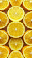 Fresh juicy orange slices arranged in rows on dark background, showing bright yellow pulp and natural texture. For food industry and healthy lifestyle concepts.