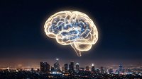 Glowing brain hologram floating above illuminated city skyline at night representing artificial intelligence, innovation and smart city technology concepts.