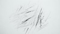 Abstract black pencil scribbles and chaotic line drawing on white paper background for artistic design projects and creative concepts.