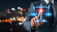 Businessman touching glowing digital scales of justice hologram against blurred city lights background representing legal technology and law firm services.