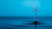 Wind turbine standing in water creating concentric ripples against blue background, symbolizing clean energy and environmental conservation.