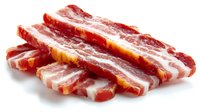 Raw bacon strips arranged in a row showing marbled texture of red meat and white fat, ready for cooking on white background.
