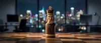 Wooden chess piece king on chessboard in modern office with city skyline lights, symbolizing strategy, leadership, and business success.