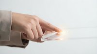 Businessman hand touching glowing digital interface with finger on white background. Modern technology and innovation concept for business presentations.