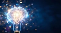 Glowing light bulb with brain filament surrounded by colorful bokeh lights on dark blue background representing innovation and creative thinking concepts.