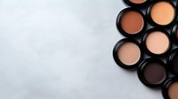 Flat lay composition of neutral tone face powder compacts arranged on light background, makeup artist professional cosmetics collection for foundation and contouring.