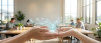 Hands holding glowing digital network connections in modern office workspace with colleagues working in background representing teamwork and collaboration.