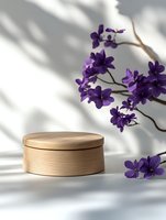 Purple orchid flowers above wooden round box casting soft shadows on white background, minimalist composition for spa, beauty, and wellness products.