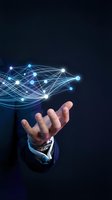 Businessman hand holding glowing digital network with connected nodes and lines on dark background, representing technology, data connection, and innovation for business solutions.